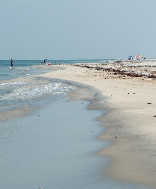People enjoying beach in Cape San Blas